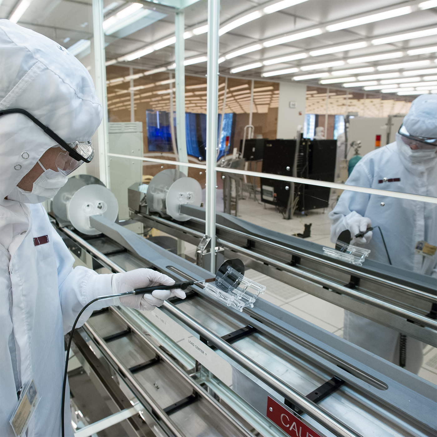 Researcher cleaning a machine