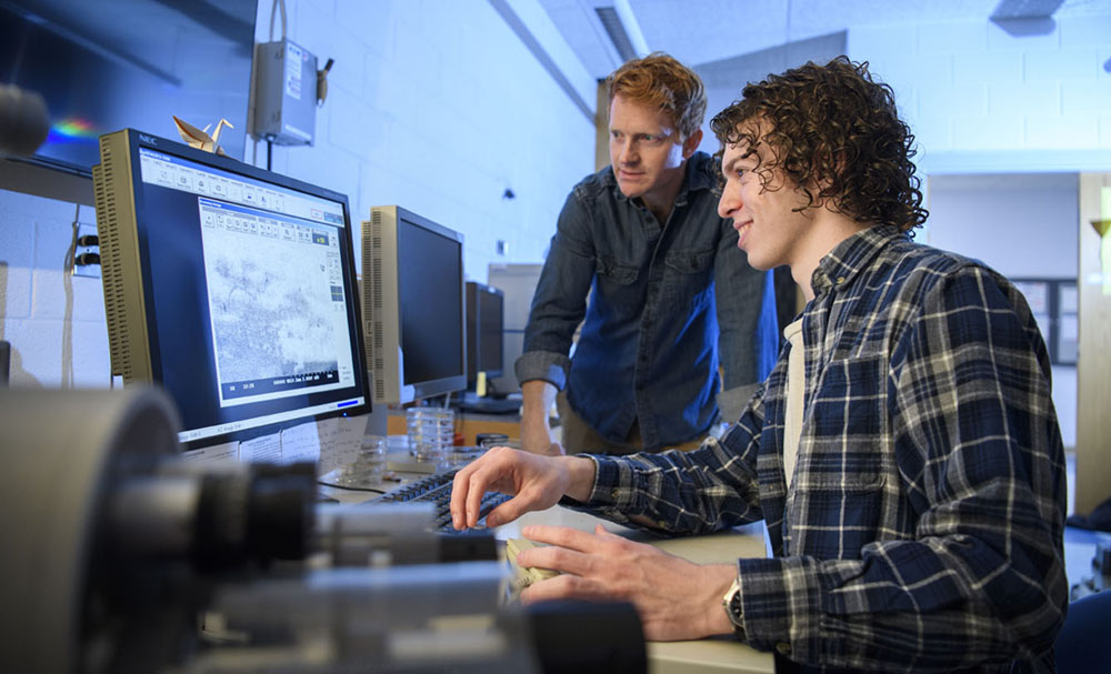 Jacob Sylvie and his faculty supervisor working on a characterization tool