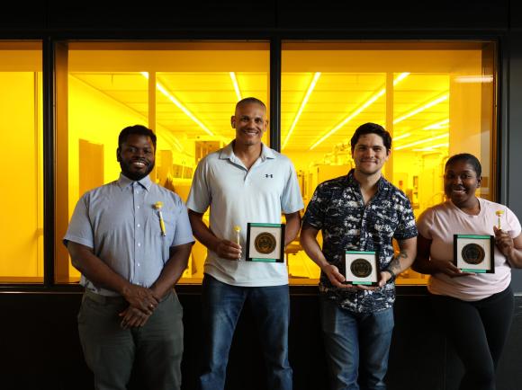 The four members of the 2025 MNCP with the wafers they made. 