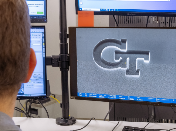 GT logo on an electron microscope