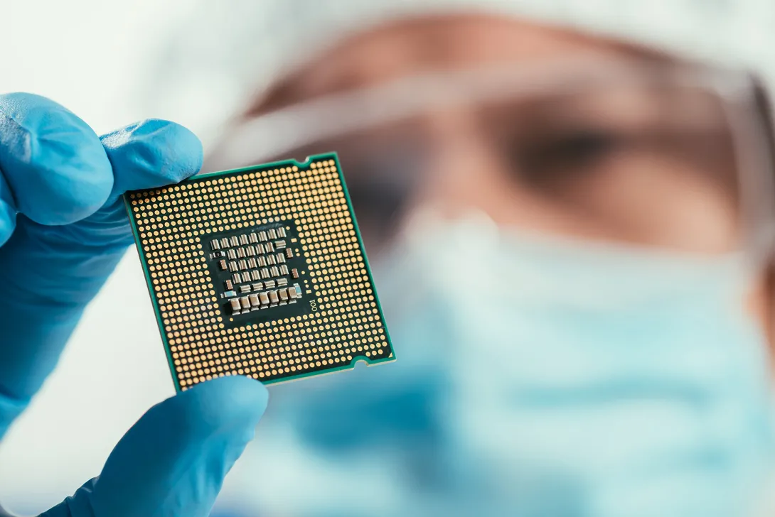 Man holding computer chip