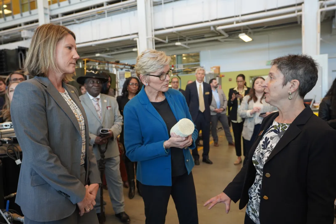 U.S. Secretary of Energy Jennifer Granholm (center) is brought up to date by Georgia Tech&#039;s Krista Walton (left) and Jennifer Hirsch (right) during a 2024 visit to campus.